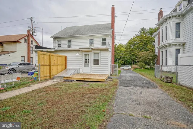 a view of a house with a street