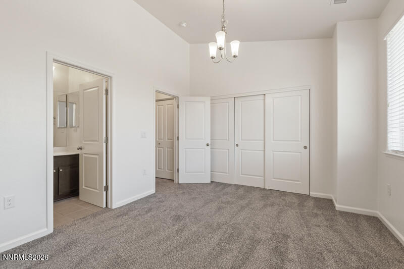 285 Mark Jeffrey Lane Reno, NV 89503 - Photo 11 of 20 a view of an empty room with chandelier fan