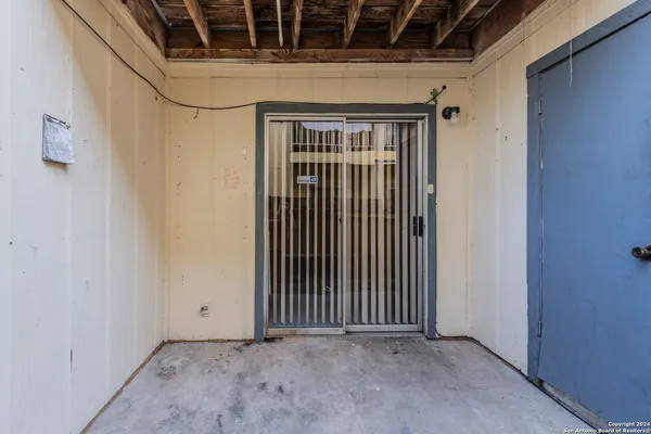 a view of a door with wooden floor