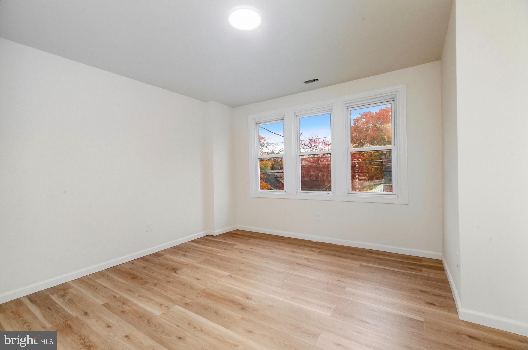2446 46th Street Pennsauken, NJ 08110 - Photo 16 of 25 a view of empty room with wooden floor and fan