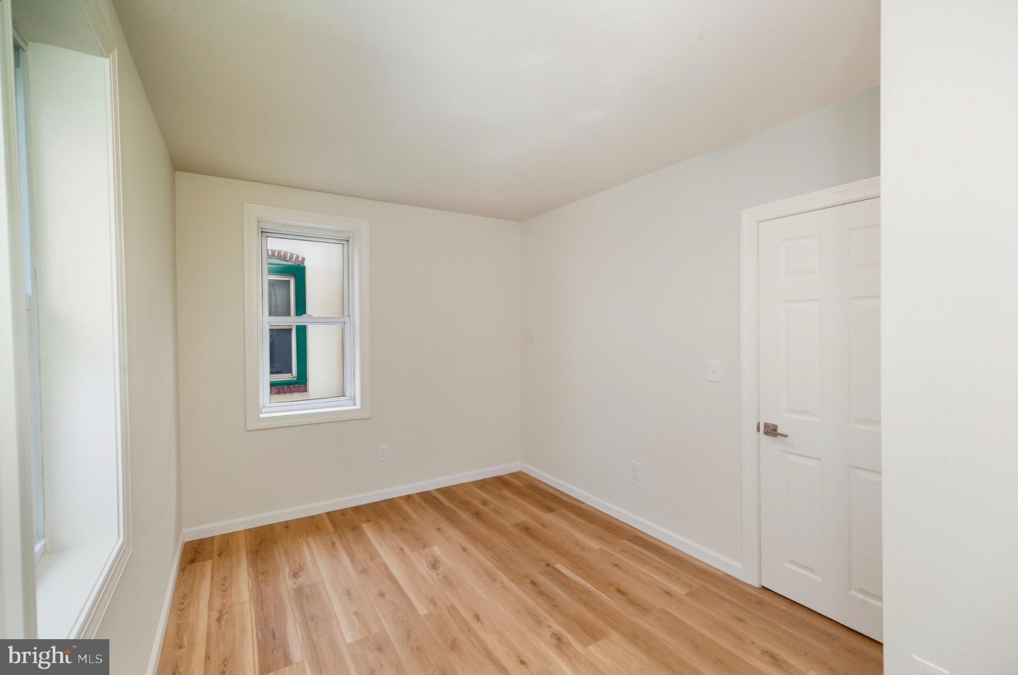 2446 46th Street Pennsauken, NJ 08110 - Photo 19 of 25 a view of empty room with wooden floor and fan
