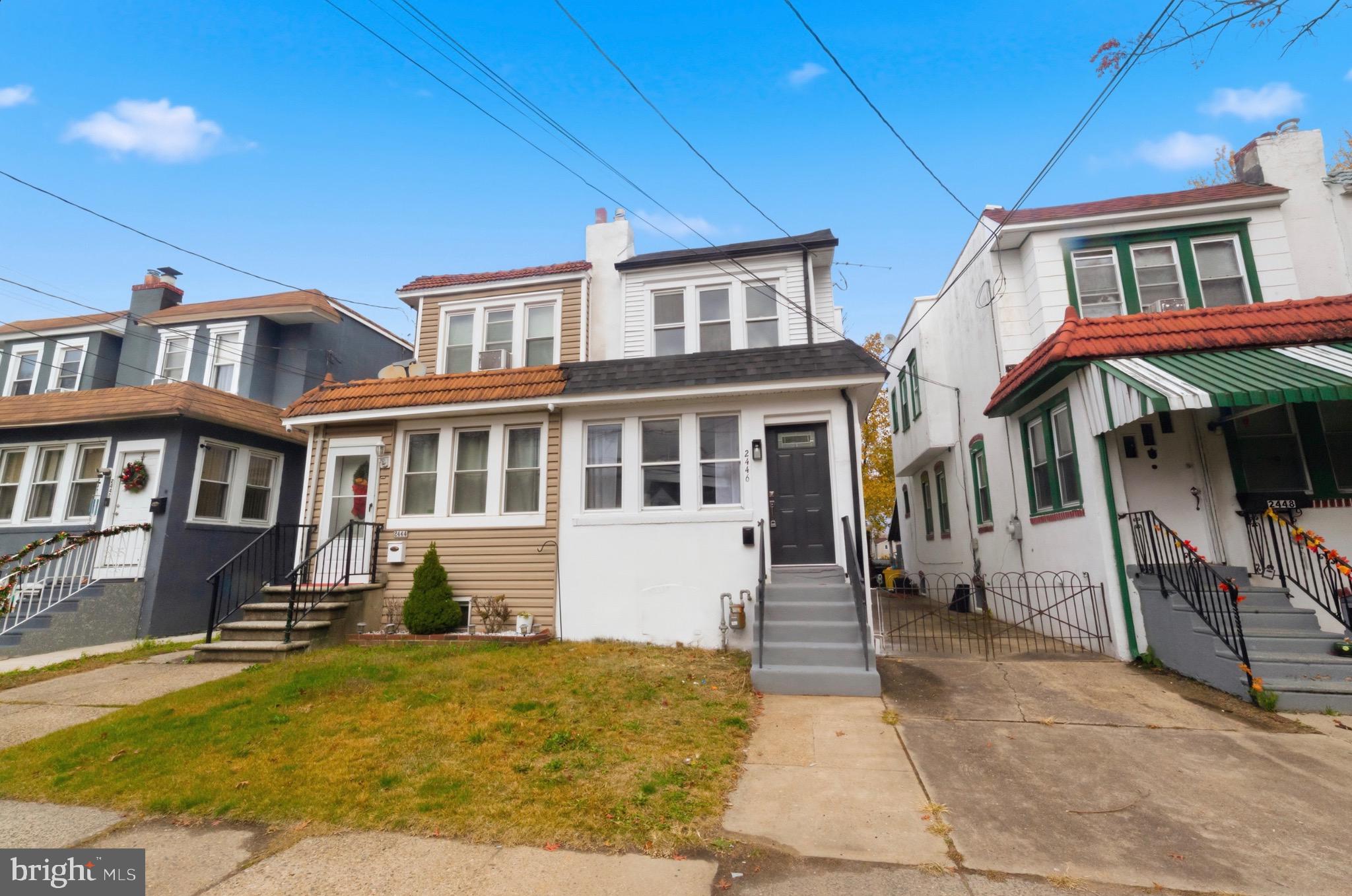 2446 46th Street Pennsauken, NJ 08110 - Photo 2 of 25 a front view of a house with a yard