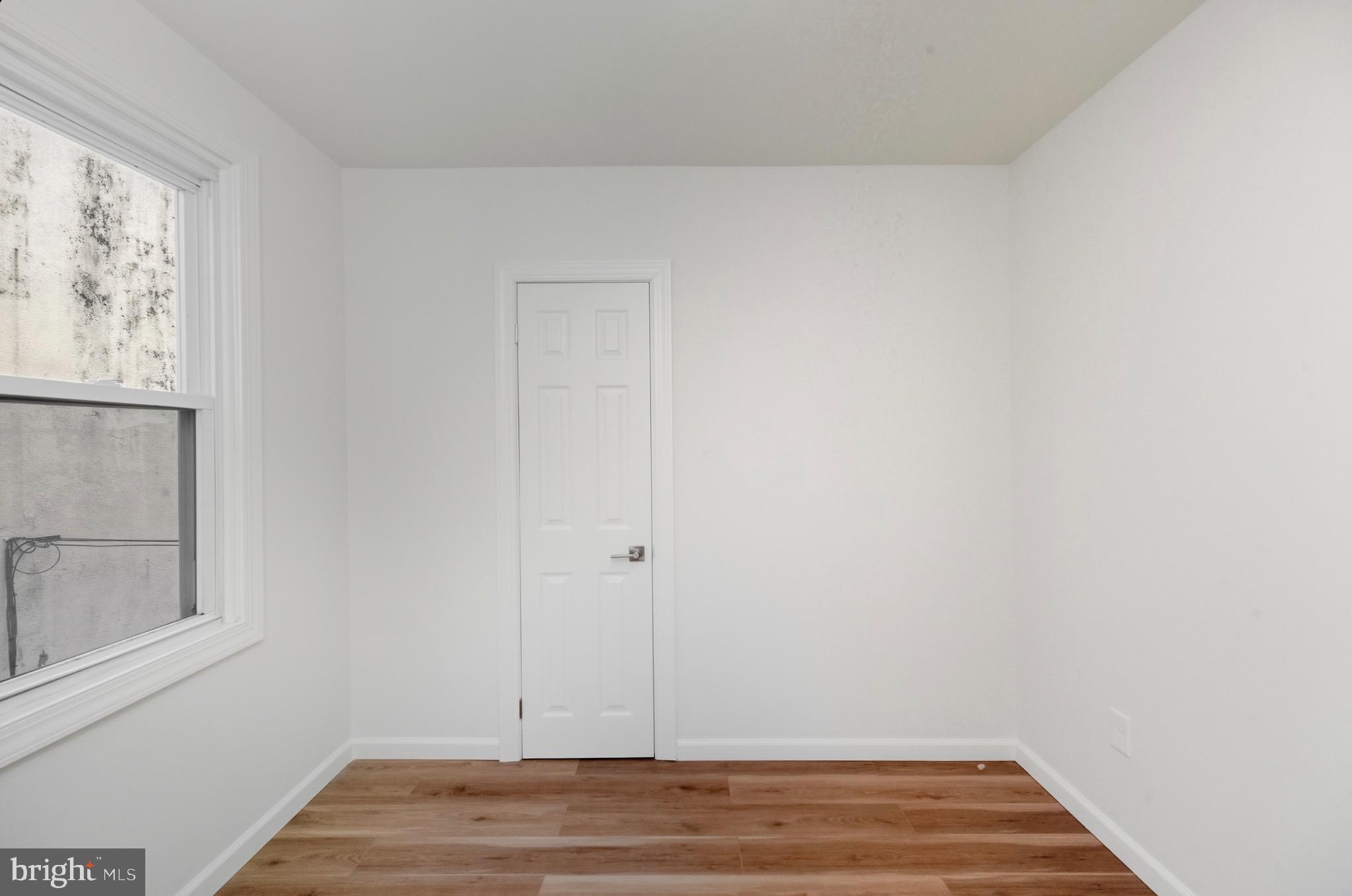 2446 46th Street Pennsauken, NJ 08110 - Photo 22 of 25 a view of room with window and wooden floor