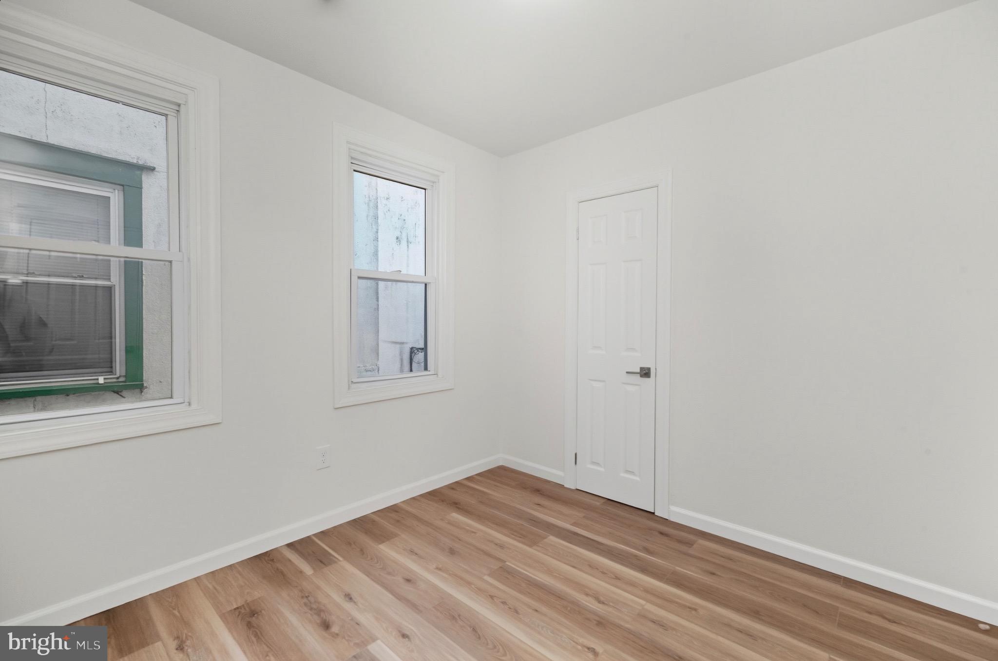 2446 46th Street Pennsauken, NJ 08110 - Photo 23 of 25 a view of empty room with wooden floor and fan