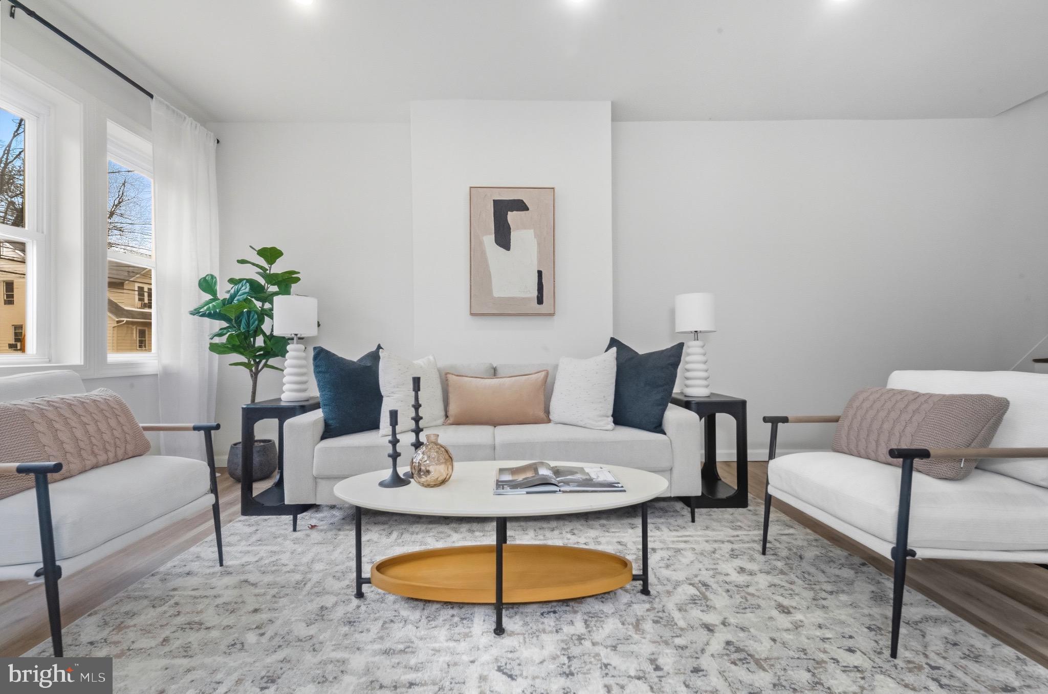 2446 46th Street Pennsauken, NJ 08110 - Photo 4 of 25 a living room with furniture and a rug