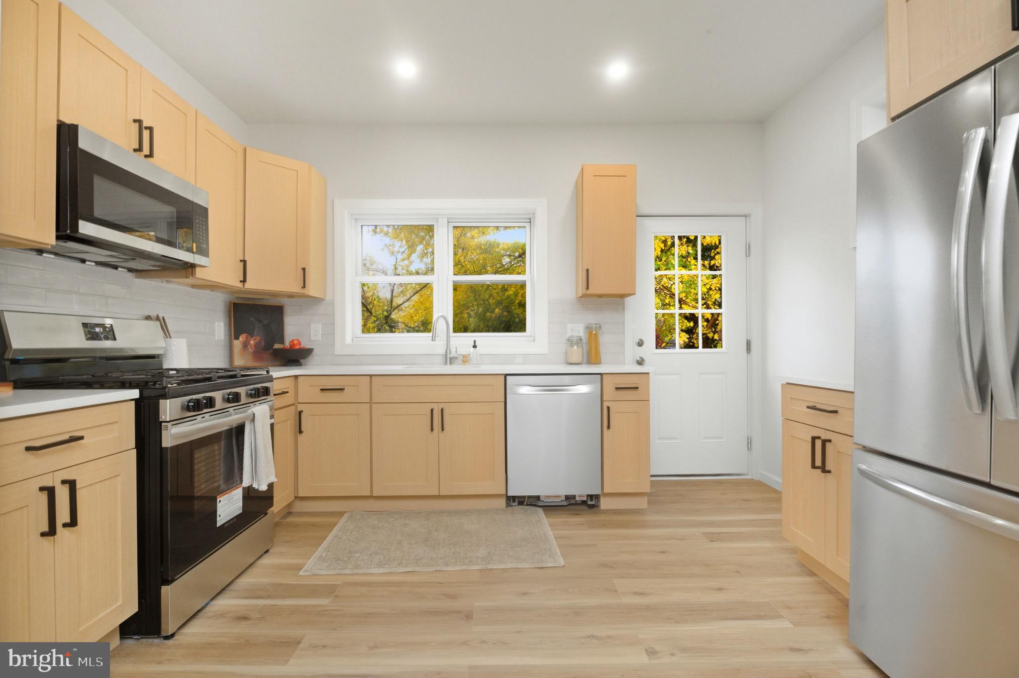 2446 46th Street Pennsauken, NJ 08110 - Photo 9 of 25 a kitchen with a sink appliances and cabinets