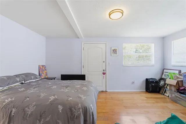 a bedroom with a bed and a chair