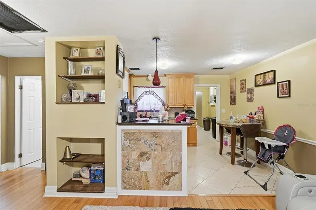 a kitchen with sink a window and cabinets