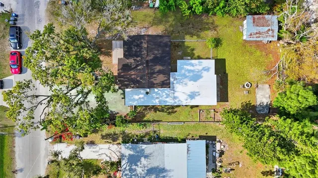 an aerial view of residential houses with outdoor space