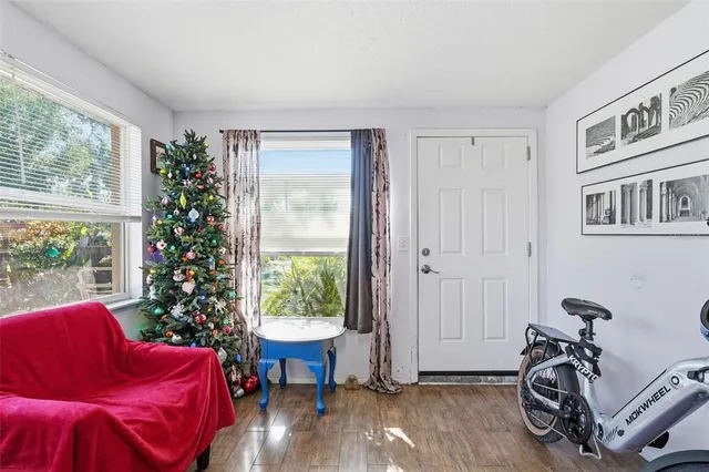 a living room with furniture couch and a large window