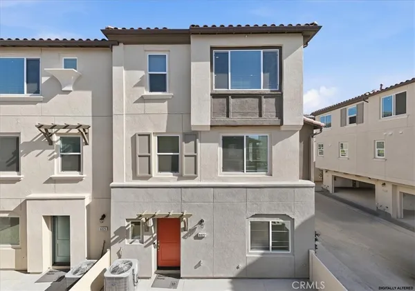 a front view of a house with a balcony