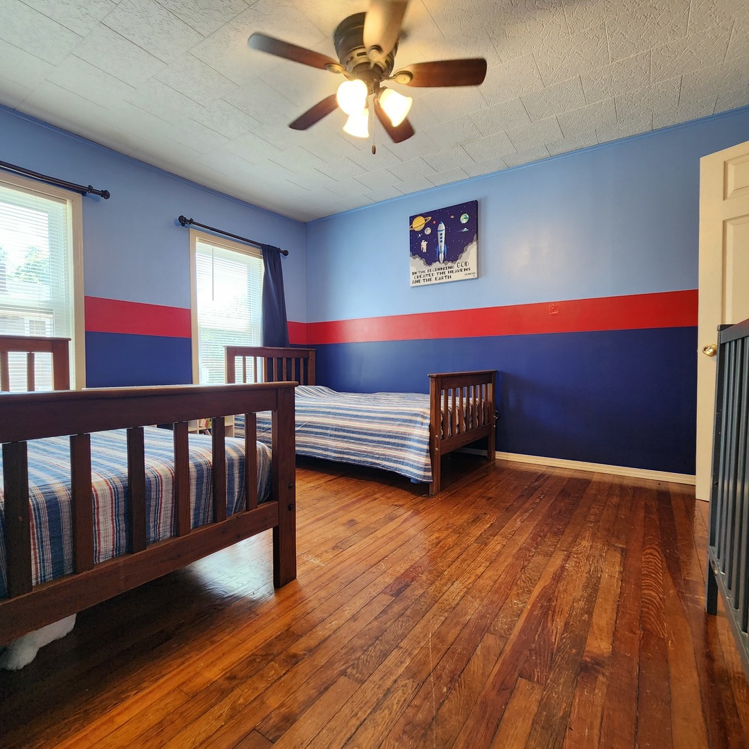700 West Lafayette Street Ottawa, IL 61350 - Photo 15 of 24 a view of a livingroom with wooden floor and a ceiling fan