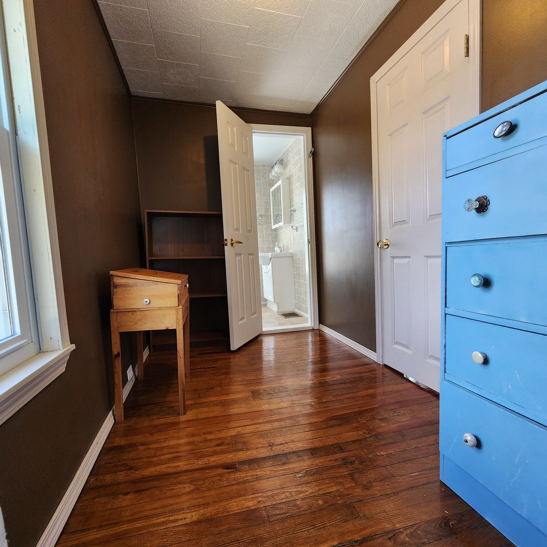 700 West Lafayette Street Ottawa, IL 61350 - Photo 17 of 24 a view of room with wooden floor and staircase