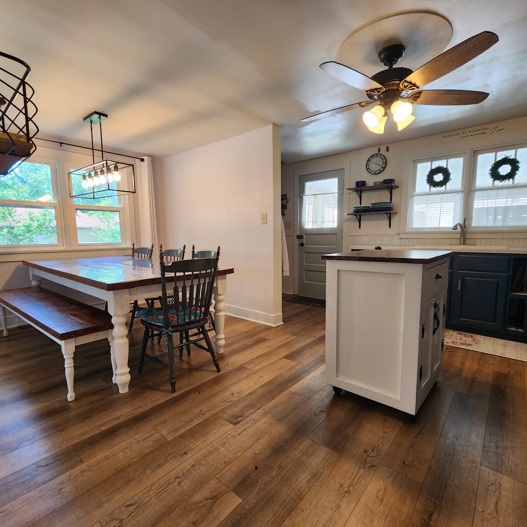 700 West Lafayette Street Ottawa, IL 61350 - Photo 5 of 24 a kitchen with kitchen island stainless steel appliances a dining table chairs and wooden floor