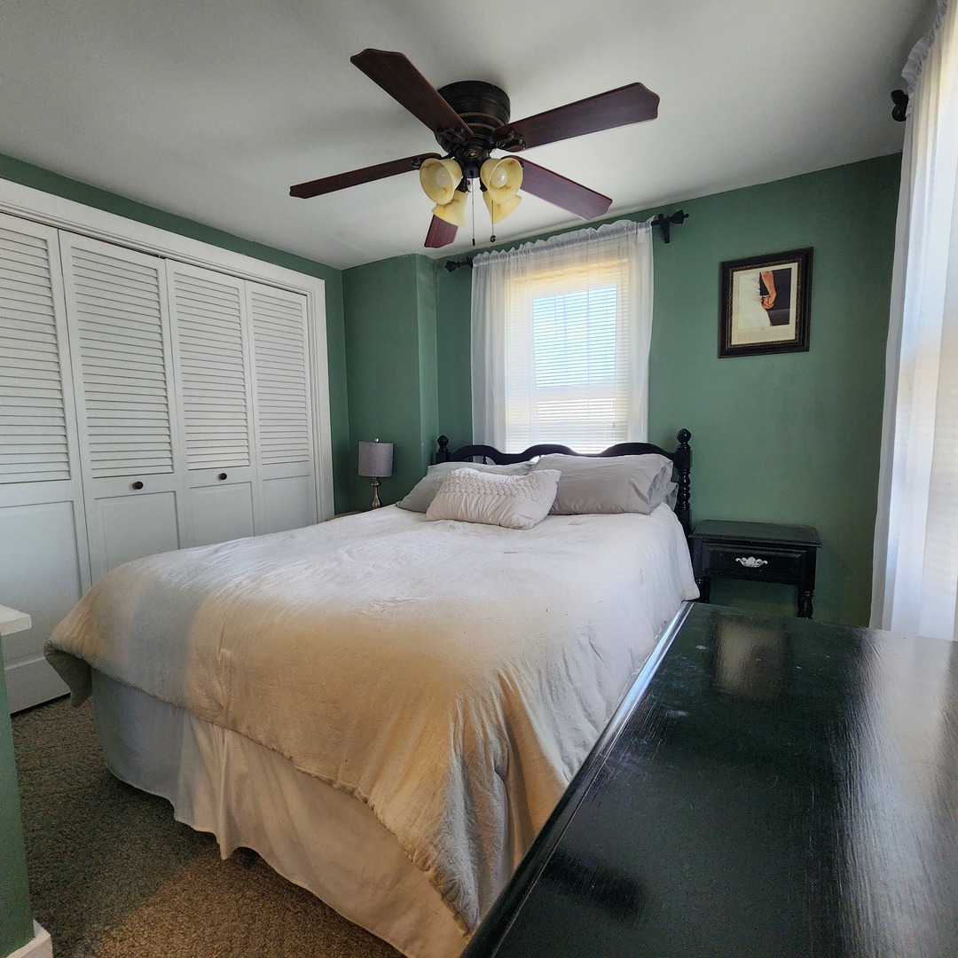 700 West Lafayette Street Ottawa, IL 61350 - Photo 9 of 24 a bedroom with a bed and window