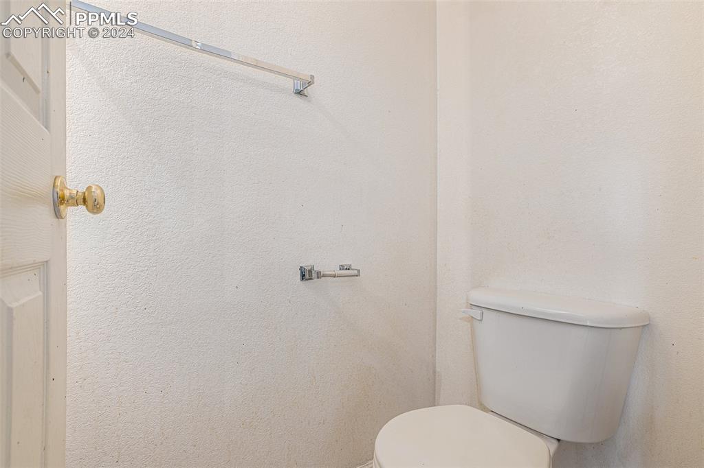 4400 Rawhide Road, Unit 159 Pueblo, CO 81008 - Photo 17 of 22 a white toilet sitting next to a shower