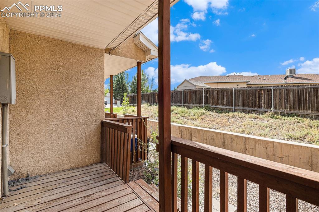 4400 Rawhide Road, Unit 159 Pueblo, CO 81008 - Photo 19 of 22 a view of balcony with wooden floor