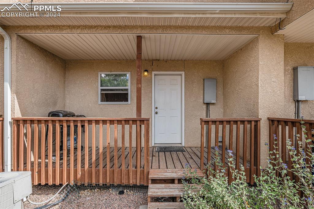 4400 Rawhide Road, Unit 159 Pueblo, CO 81008 - Photo 5 of 22 a view of a porch with wooden floor