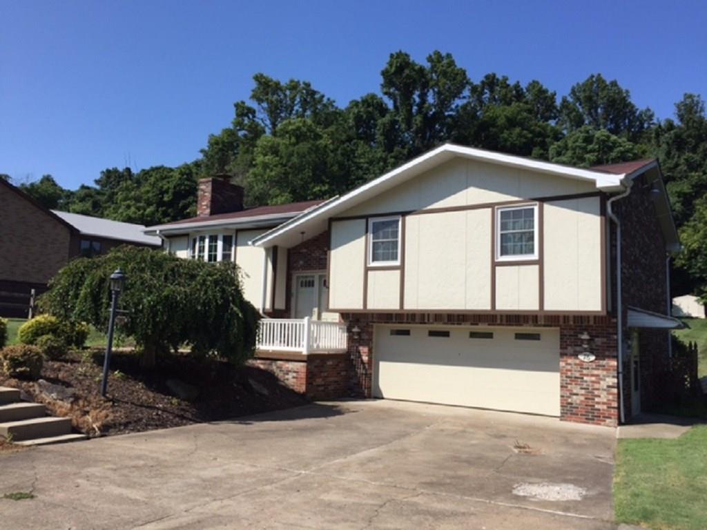 76 Fulton Road Canonsburg, PA 15317 - Photo 2 of 25 This brick and vinyl split entry has a 2 car integral garage and a paved driveway.