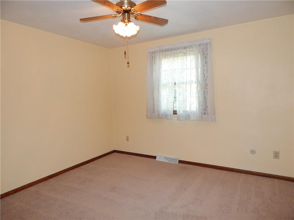 76 Fulton Road Canonsburg, PA 15317 - Photo 13 of 25 The Second Bedroom has a lighted ceiling fan that matches the wood trim.