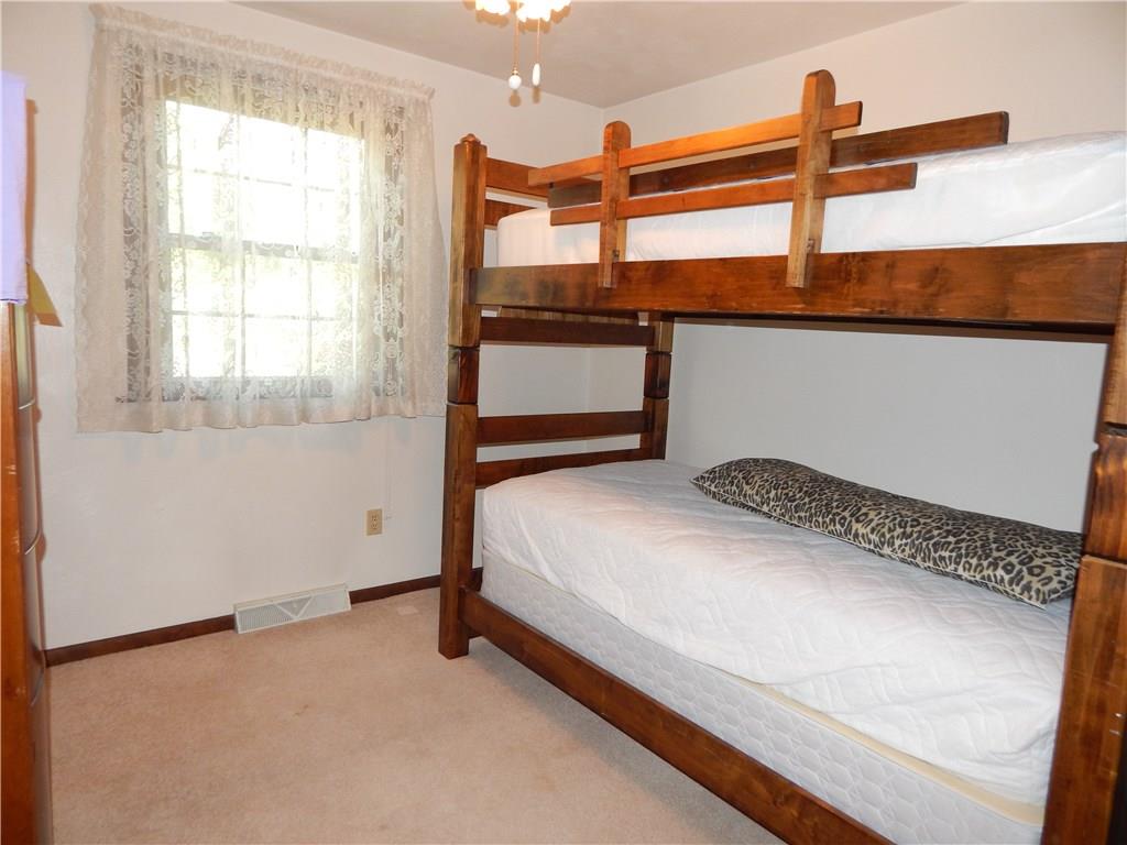 76 Fulton Road Canonsburg, PA 15317 - Photo 14 of 25 The Third Bedroom has a lighted ceiling fan, white walls and multi-pane windows with wood trim.