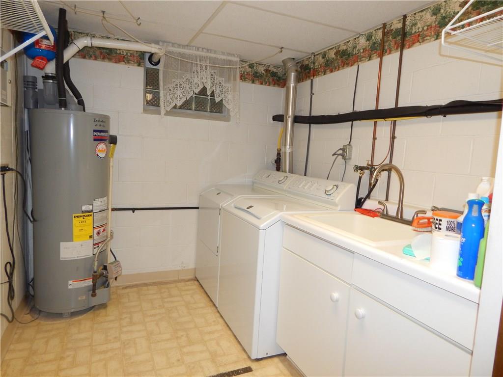 76 Fulton Road Canonsburg, PA 15317 - Photo 18 of 25 The Laundry Room has a sink with a long faucet which makes it easier to clean larger items. The vinyl flooring takes the worry away from spilling accidents.
