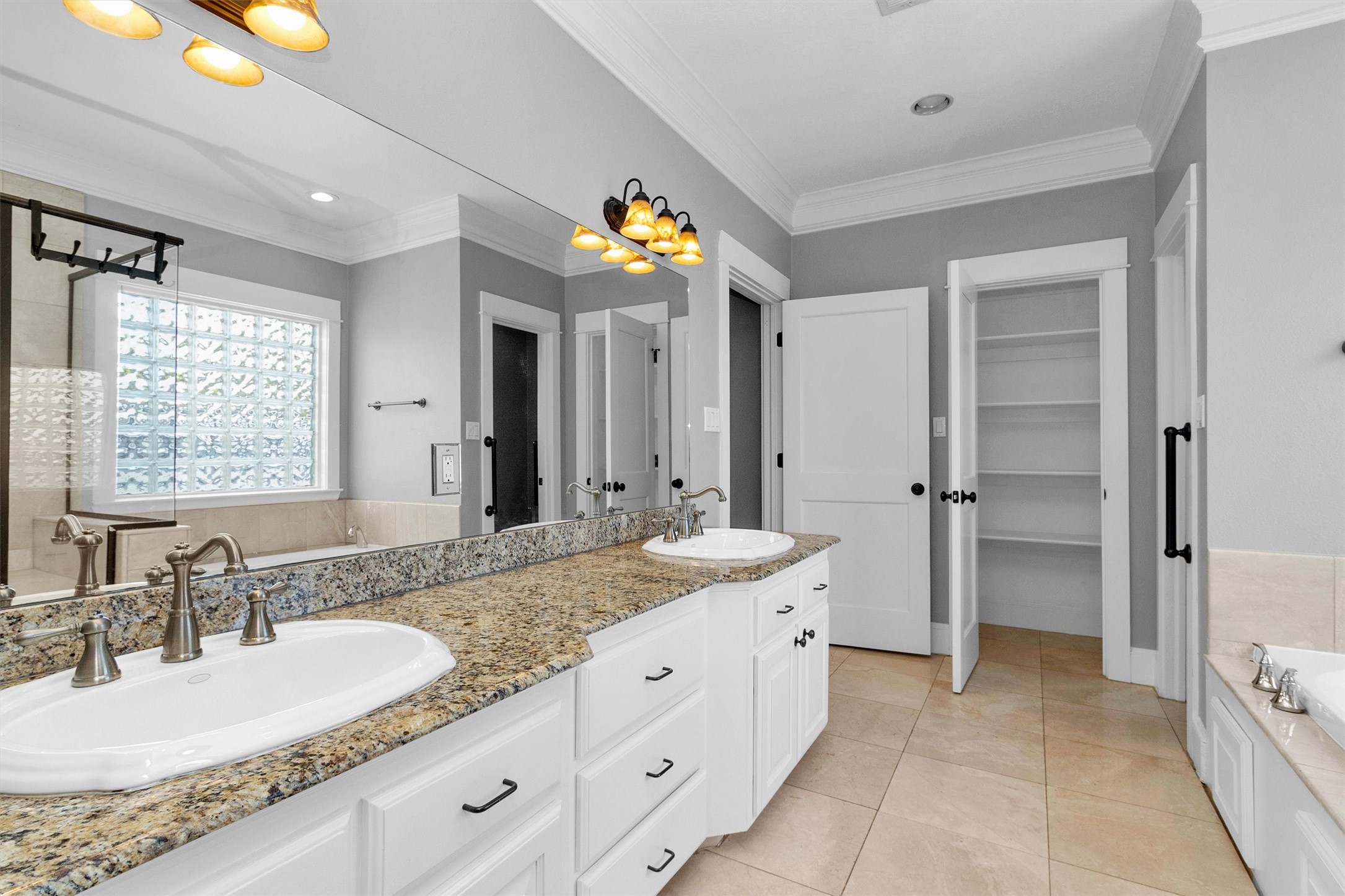 304 Vincent Street Houston, TX 77009 - Photo 28 of 36 a spacious bathroom with a granite countertop sink and a mirror