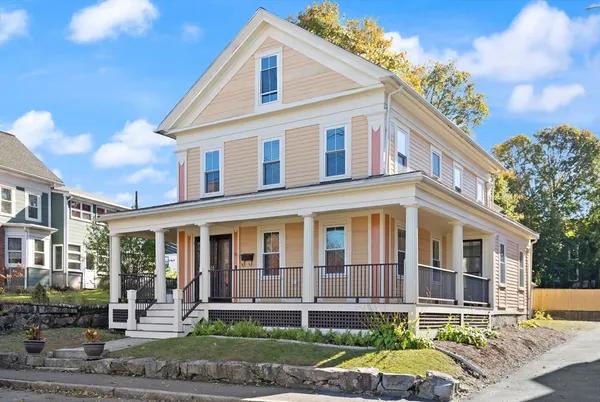 a front view of a house with garden and patio