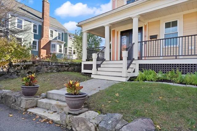 a front view of a house with a garden