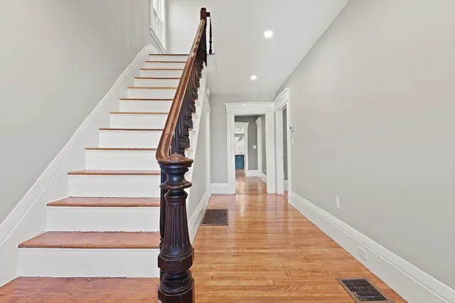a view of entryway with wooden floor