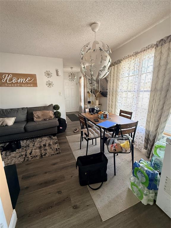 1805 Michigan Avenue, Unit D Kissimmee, FL 34744 - Photo 3 of 9 a living room with furniture and a chandelier