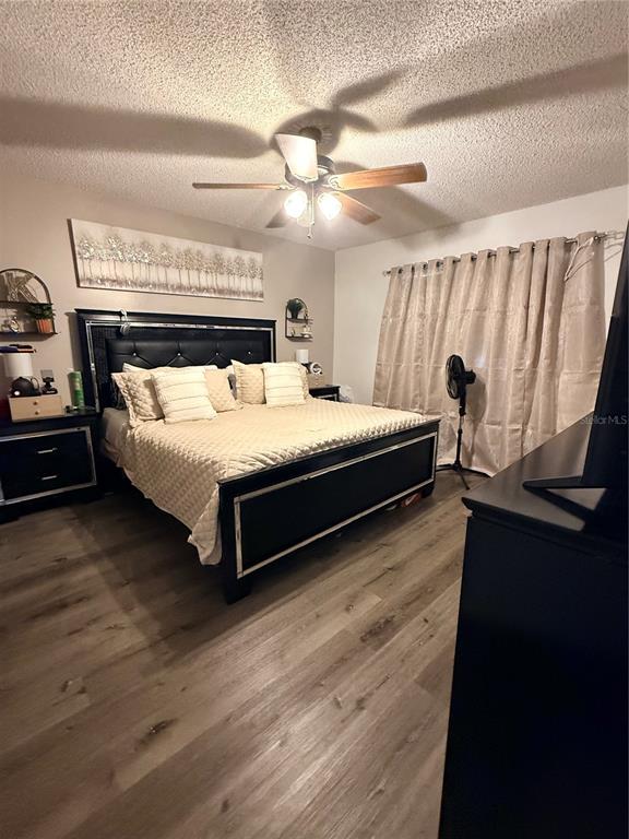 1805 Michigan Avenue, Unit D Kissimmee, FL 34744 - Photo 7 of 9 a bed sitting in a bedroom next to a window