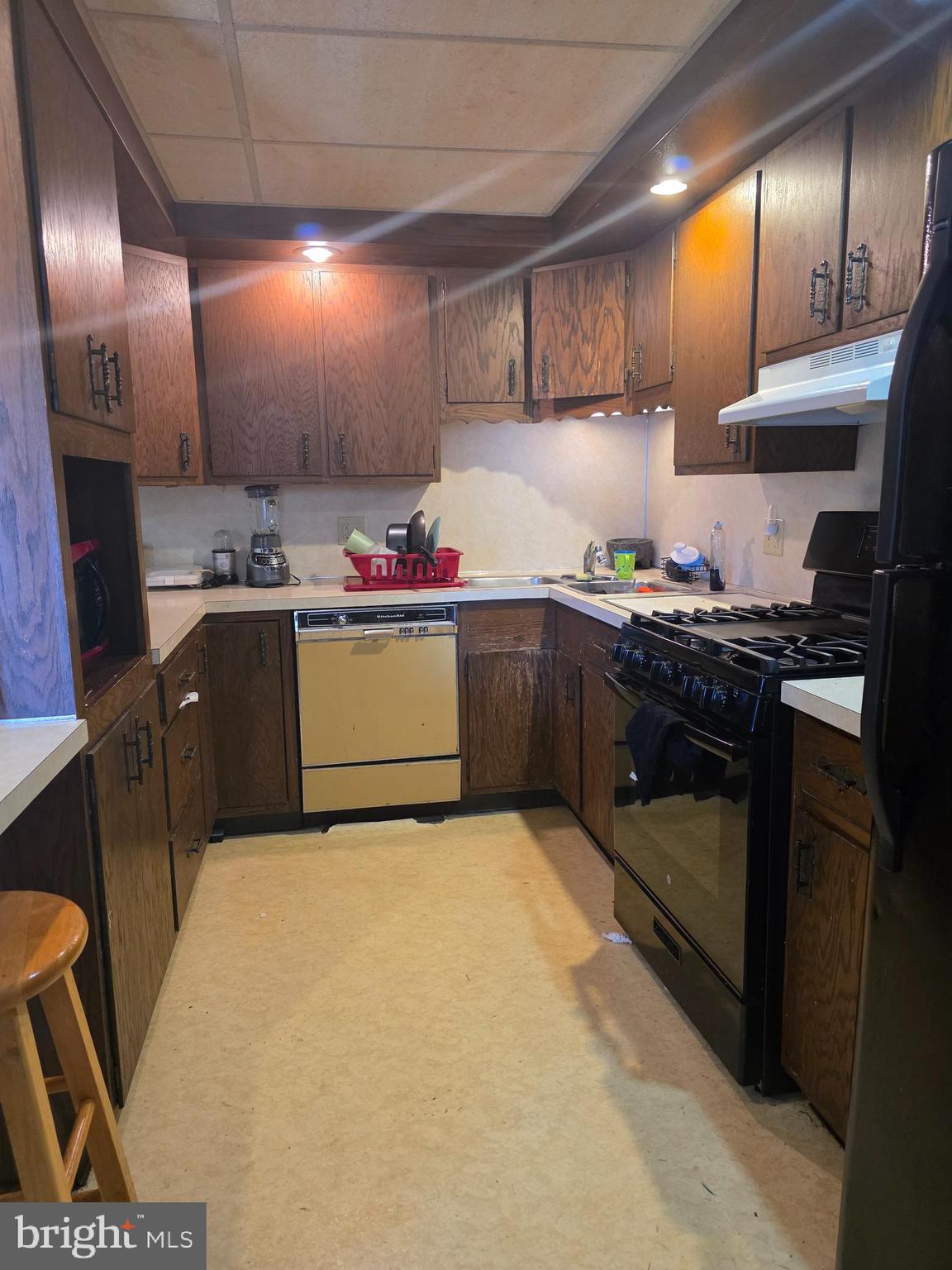 528 Maple Street Lebanon, PA 17046 - Photo 15 of 30 a kitchen with stainless steel appliances granite countertop a sink stove and refrigerator