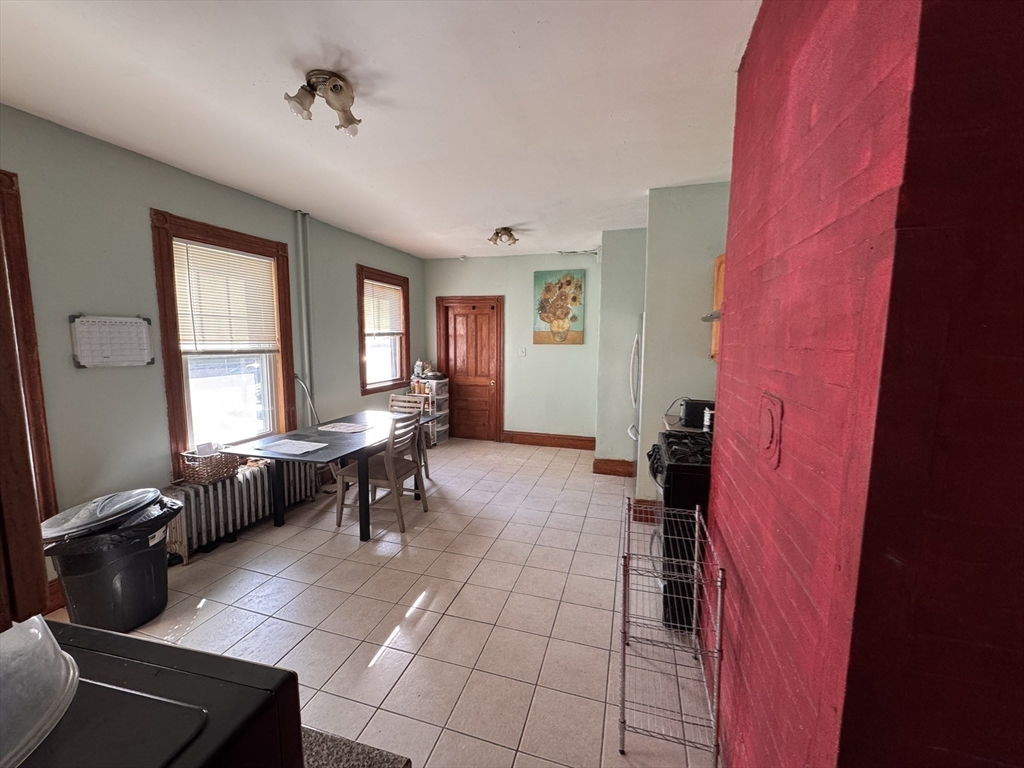 472 Warren Street Boston, MA 02121 - Photo 16 of 42 a living room with furniture and a window