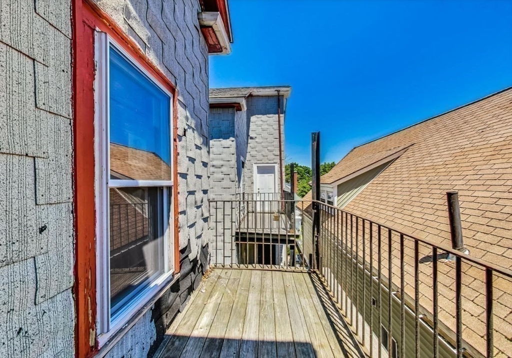 472 Warren Street Boston, MA 02121 - Photo 23 of 42 a view of a balcony with wooden floor