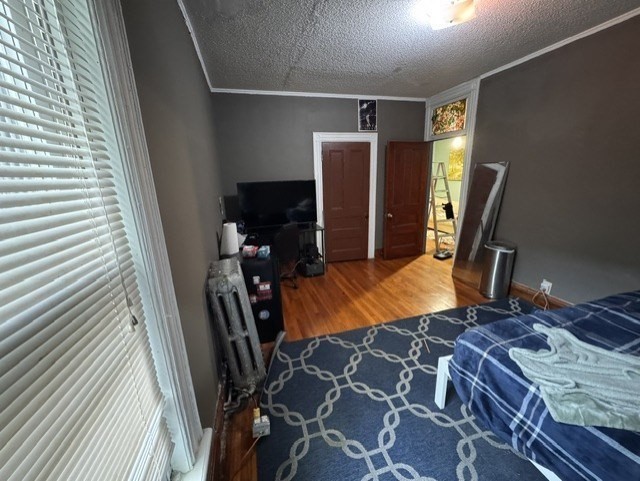 472 Warren Street Boston, MA 02121 - Photo 31 of 42 a bed room with a bed and a view