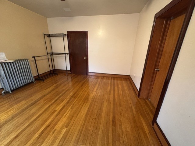 472 Warren Street Boston, MA 02121 - Photo 38 of 42 a view of a room with wooden floor and staircase