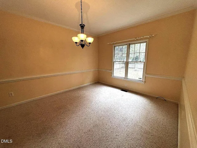 a view of empty room with windows