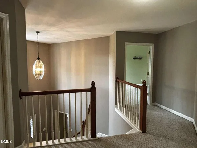 a view of a hallway with windows