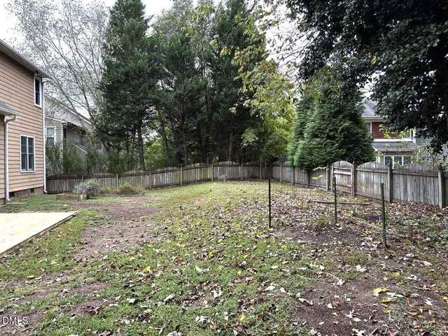 a backyard of a house with lots of green space