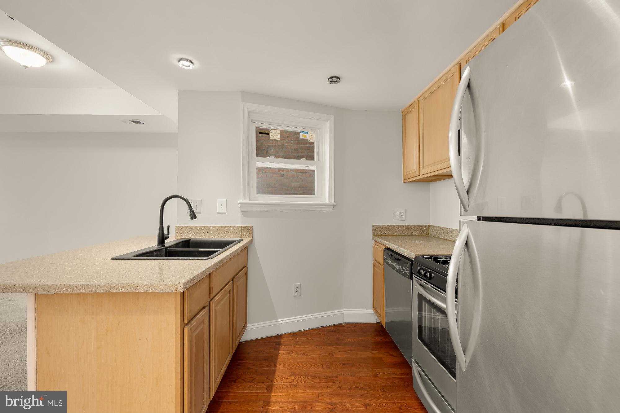 601 L Street Northeast Washington, DC 20002 - Photo 24 of 47 a kitchen with sink a stove and refrigerator