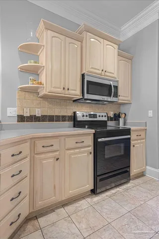 a kitchen with granite countertop white cabinets and stainless steel appliances