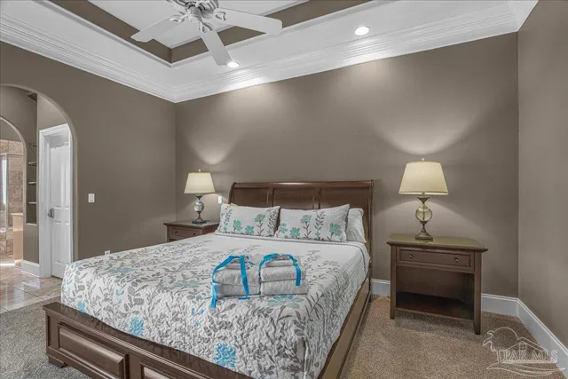 a bedroom with a bed and a lamp on table