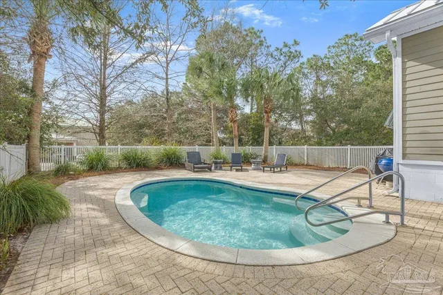 a view of a swimming pool with a patio