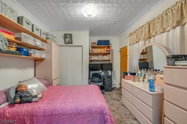 a bedroom with a bed and a large closet