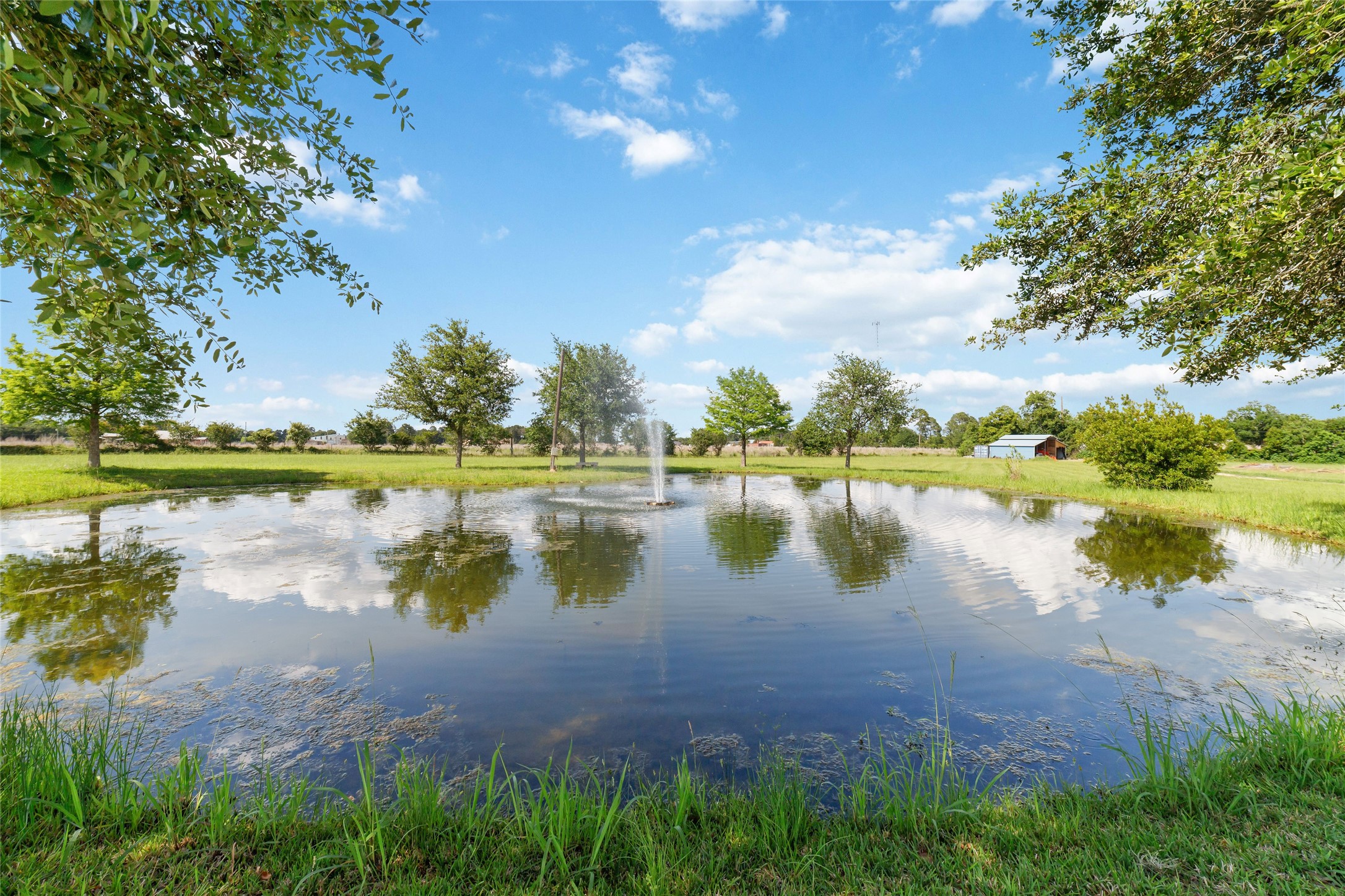 26631 Decker Prairie-Rosehill Road Magnolia, TX 77355 - Photo 11 of 20 a view of a lake with a yard