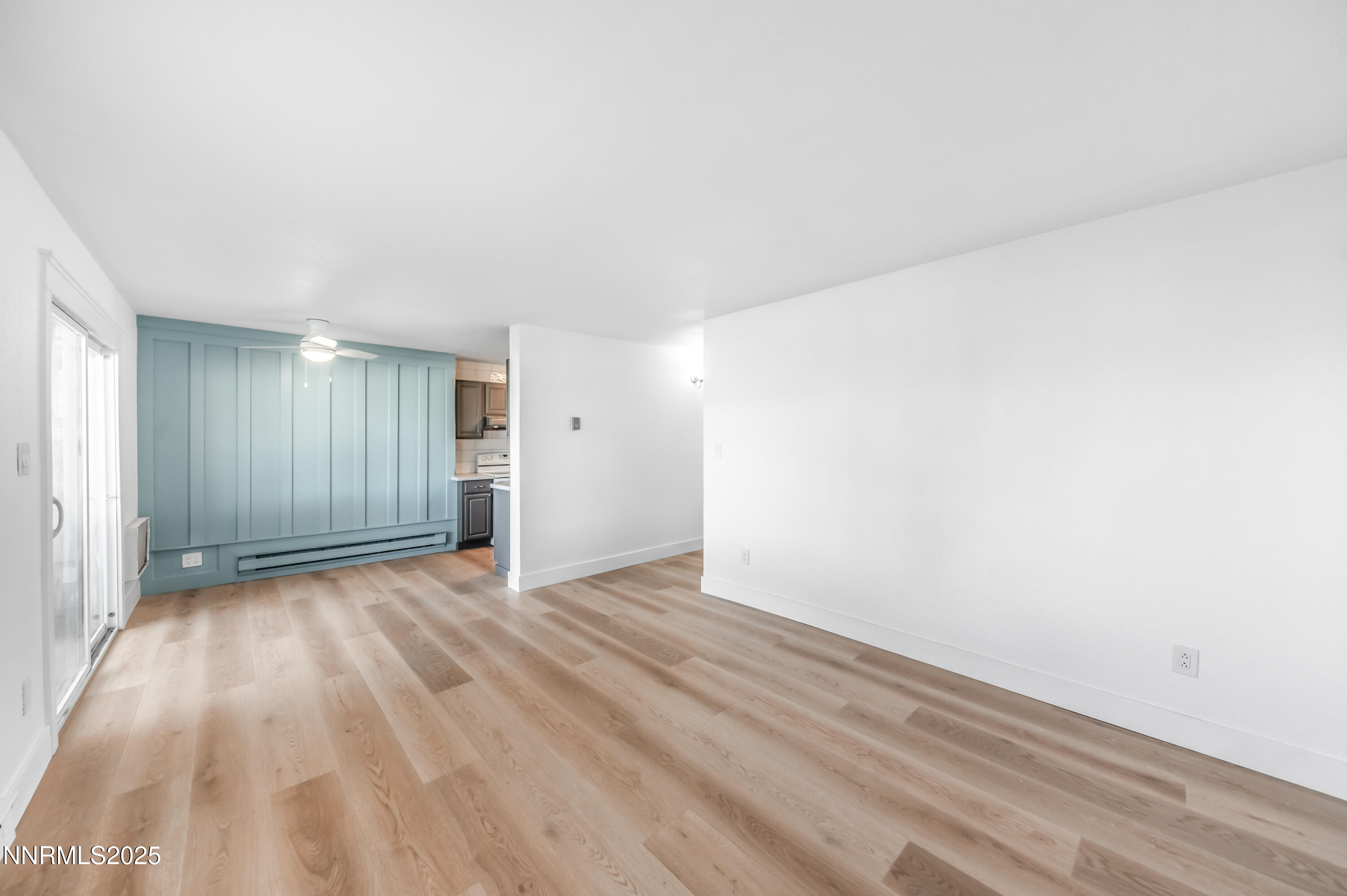 3953 Clear Acre Lane, Unit 305 Reno, NV 89512 - Photo 14 of 22 a view of an empty room and wooden floor