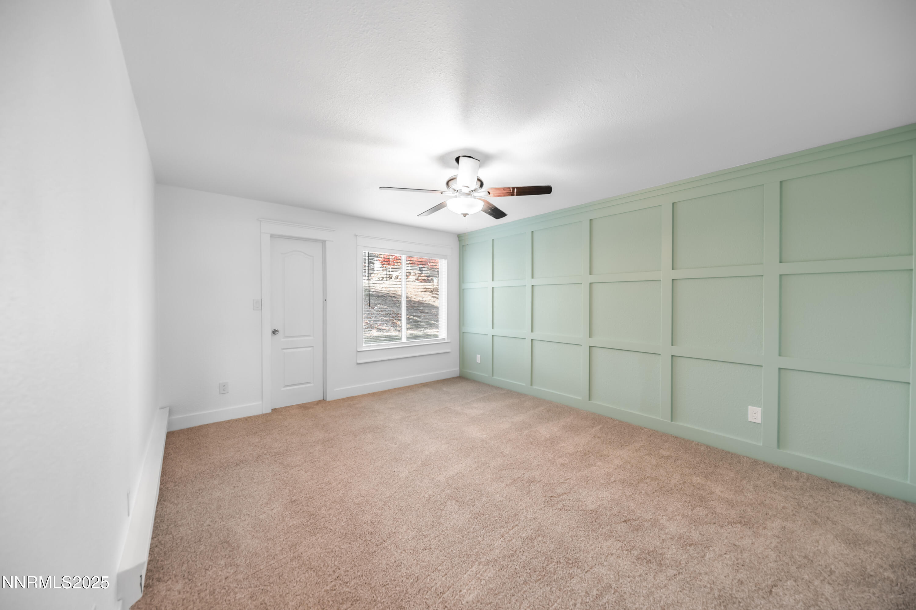 3953 Clear Acre Lane, Unit 305 Reno, NV 89512 - Photo 15 of 22 an empty room with windows and chandelier fan