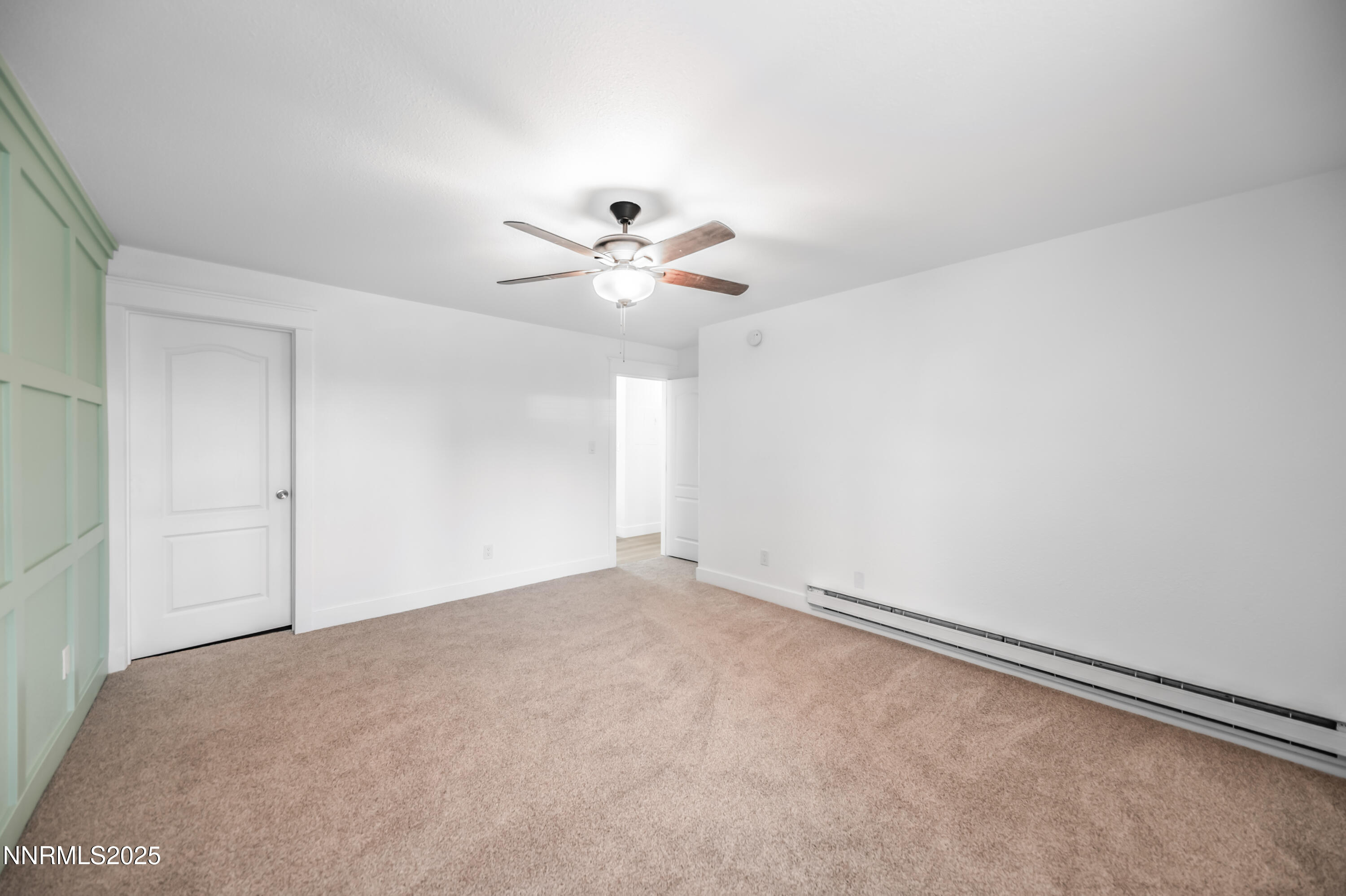 3953 Clear Acre Lane, Unit 305 Reno, NV 89512 - Photo 16 of 22 an empty room with chandelier fan and windows
