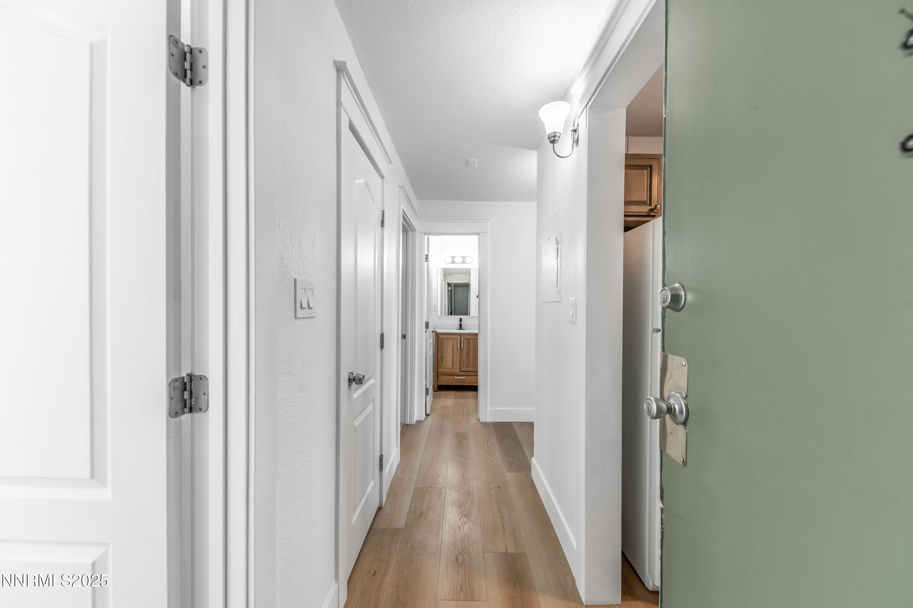 3953 Clear Acre Lane, Unit 305 Reno, NV 89512 - Photo 7 of 22 a view of a hallway with wooden floor